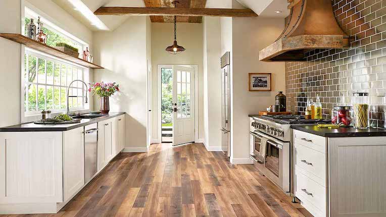 rustic wood look laminate flooring in a bright kitchen