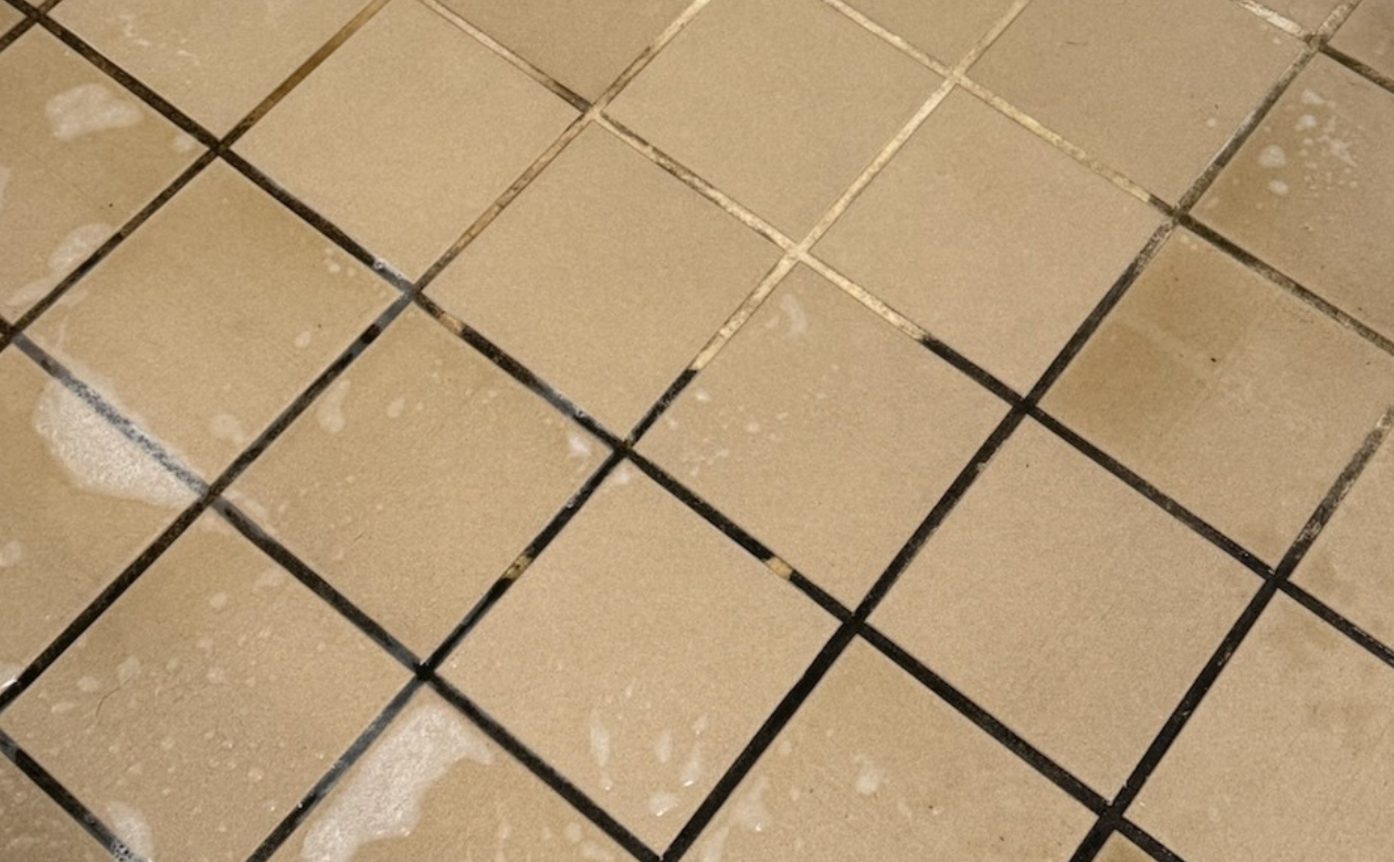 dirty grout lines in tile flooring